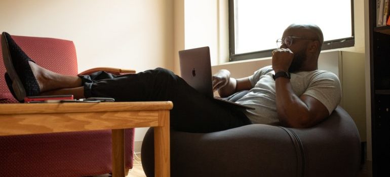 man reading tips on moving when you work from home