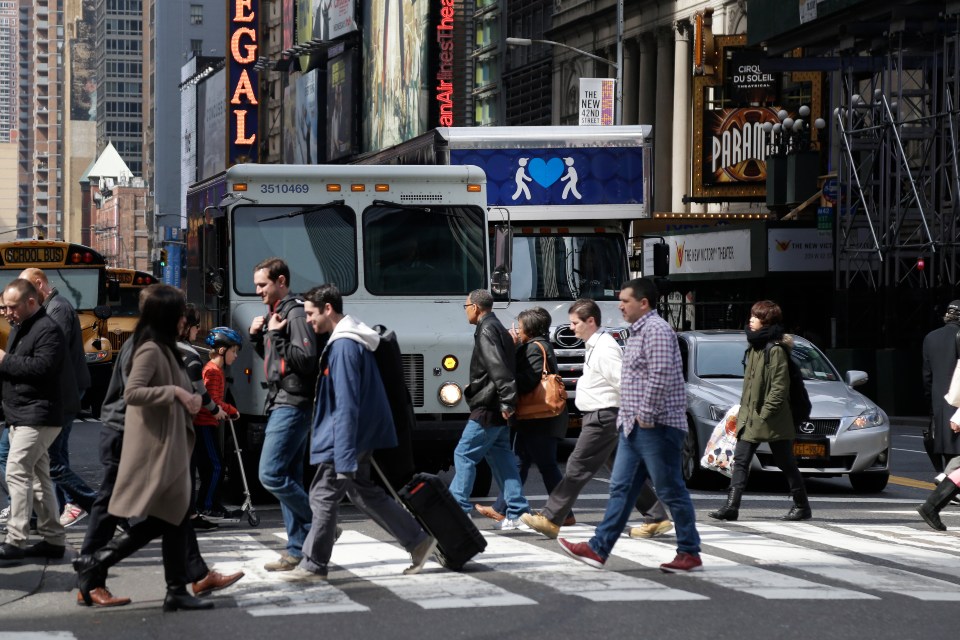 people crossing a street in New York