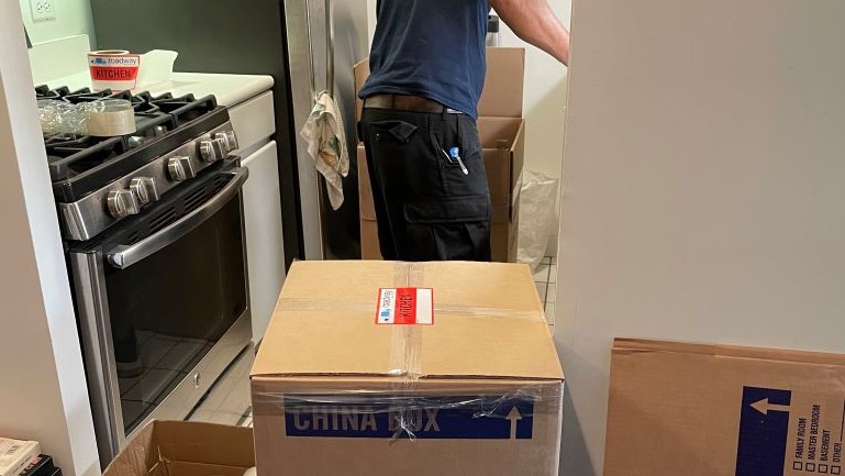 A mover working in the kitchen.