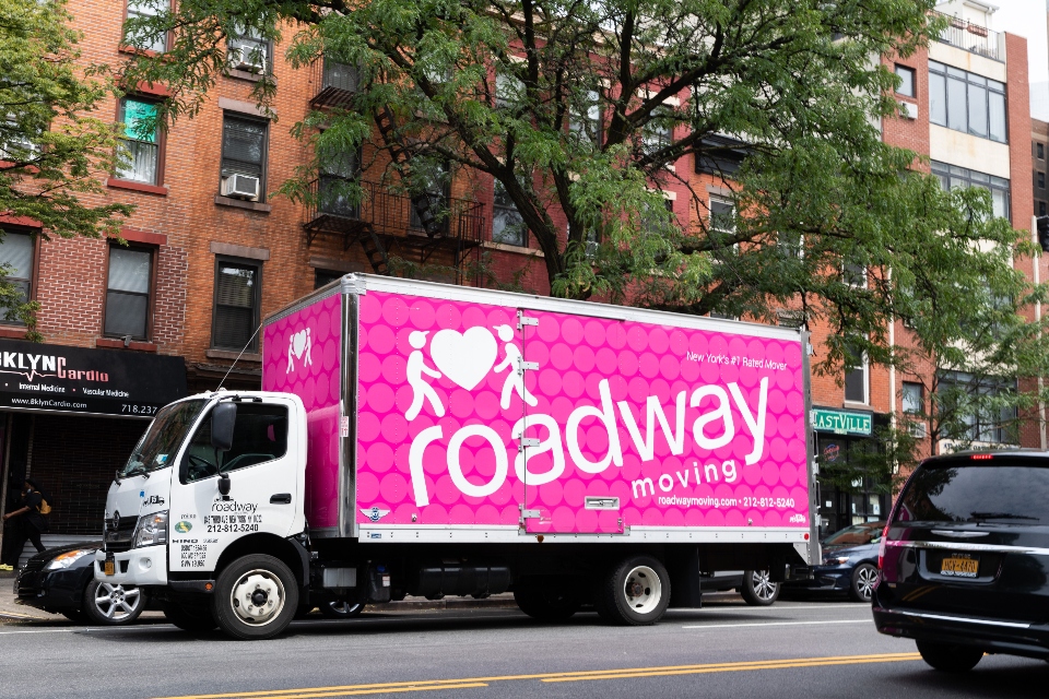 a pink moving truck