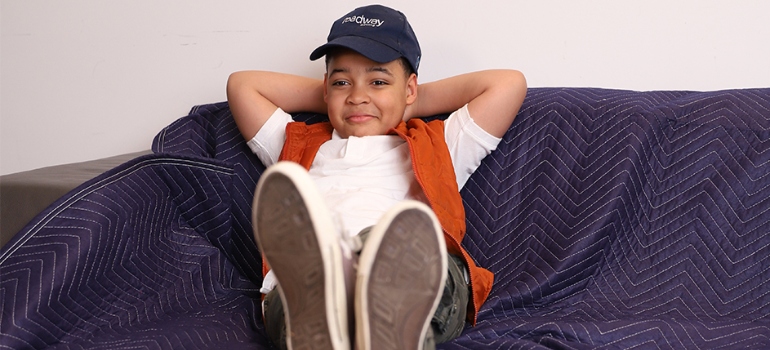 a boy sitting on the couch