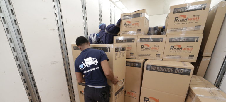A mover moving the packed boxes