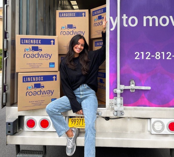 Roadway Moving crew loading boxes into a moving truck in NYC