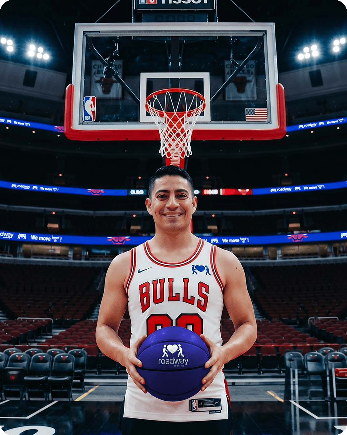 Mover in a Bulls jersey holding a Roadway Moving basketball under the hoop