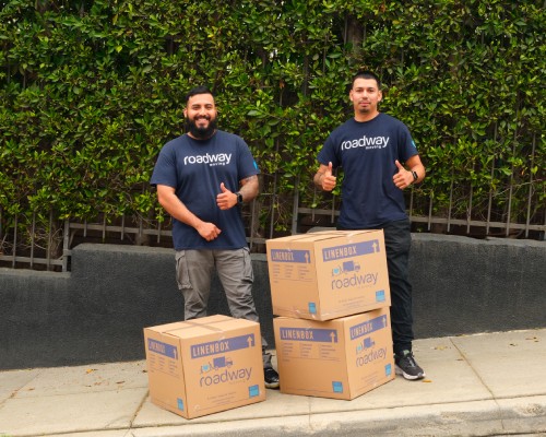 Roadway Moving crew with boxes during a Los Angeles move