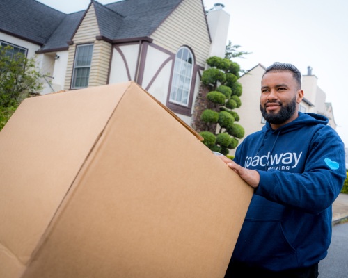 Roadway Moving mover carries a box in San Francisco