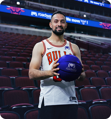 Mover holding a Roadway Moving basketball