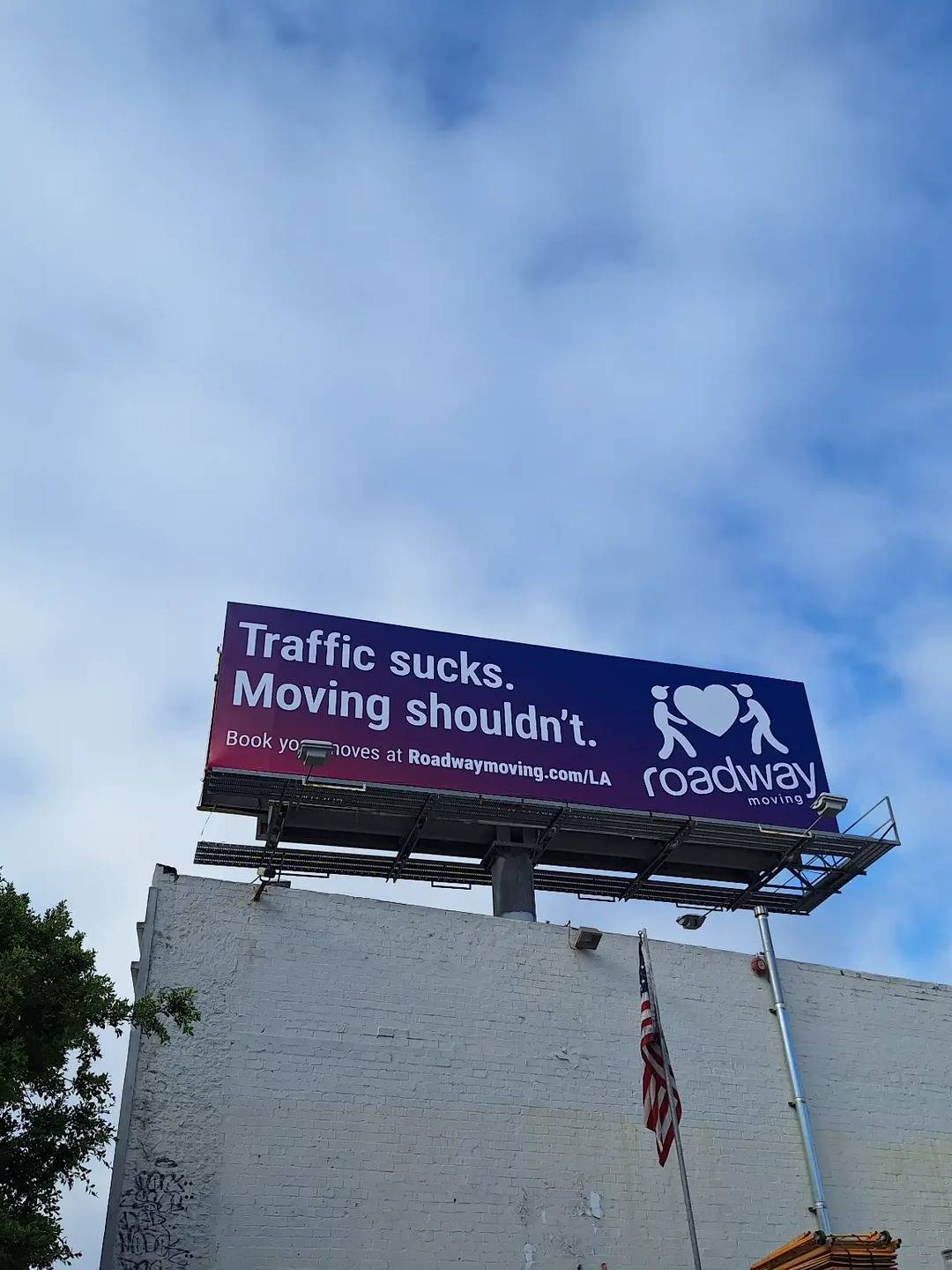 Roadway Moving billboard at La Brea Avenue and Wilshire Boulevard, Miracle Mile