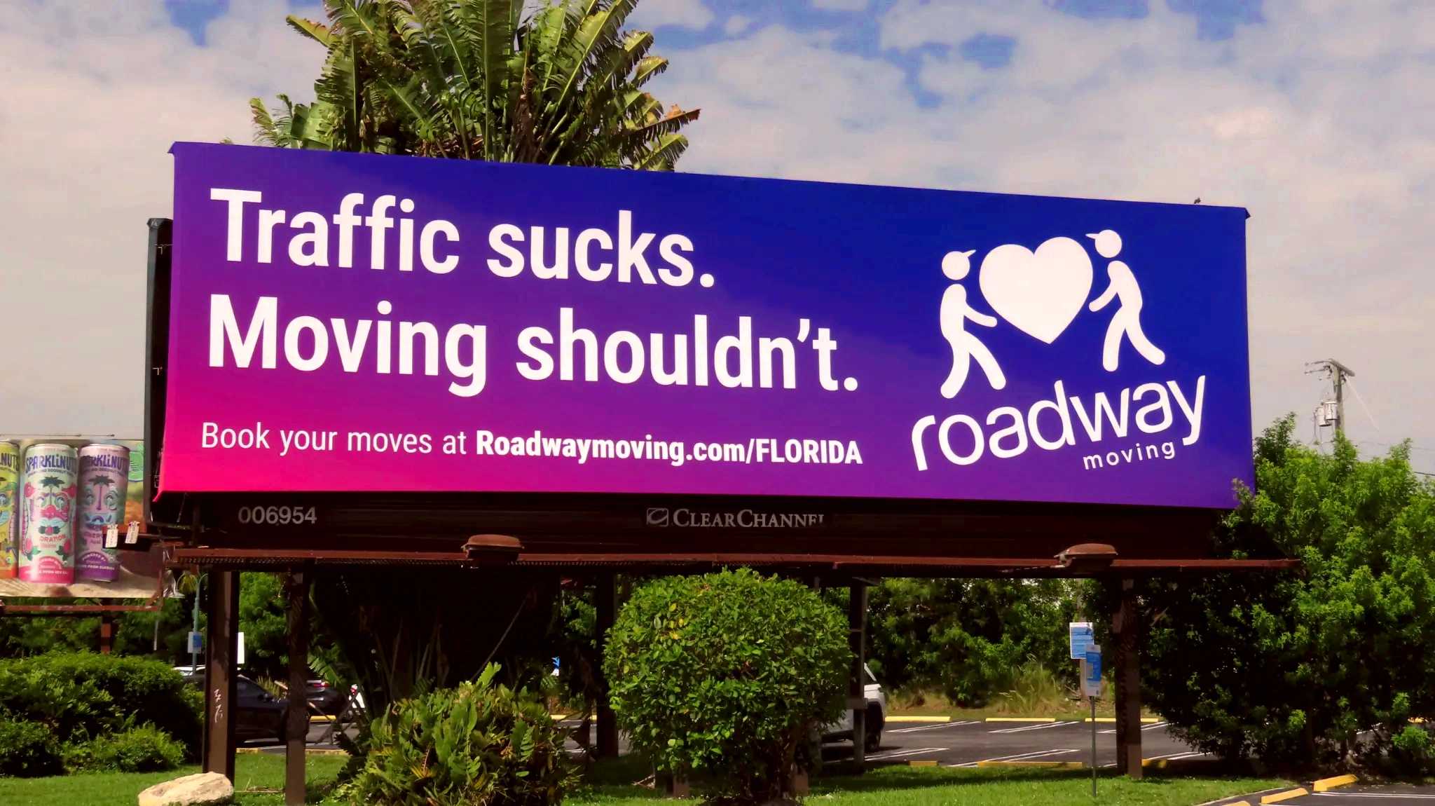 Roadway Moving billboard with the tagline: Traffic sucks. Moving shouldn't.