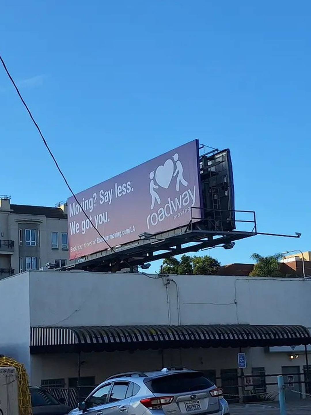 Roadway Moving billboard at Wilshire Boulevard and Wellesley Avenue, West LA