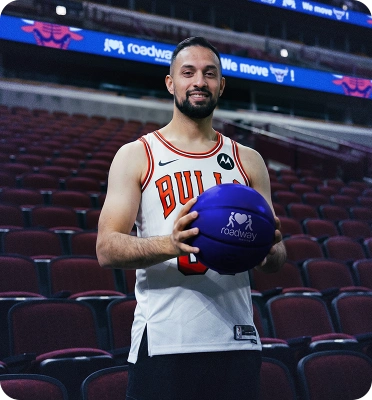 Mover holding a Roadway Moving basketball
