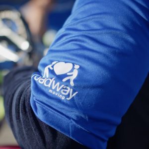 Close up of Roadway Moving_s logo on a Hand-cyclist uniform