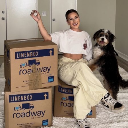 Megan Moore with her dog during a move with Roadway