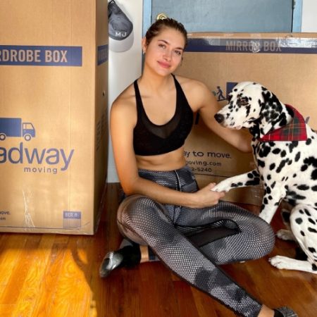 Monica Aksamit with her dog during a move with Roadway Moving